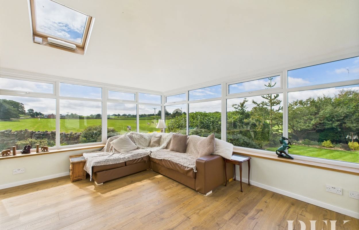 Heather Lea's bright sunroom overlooking green fields