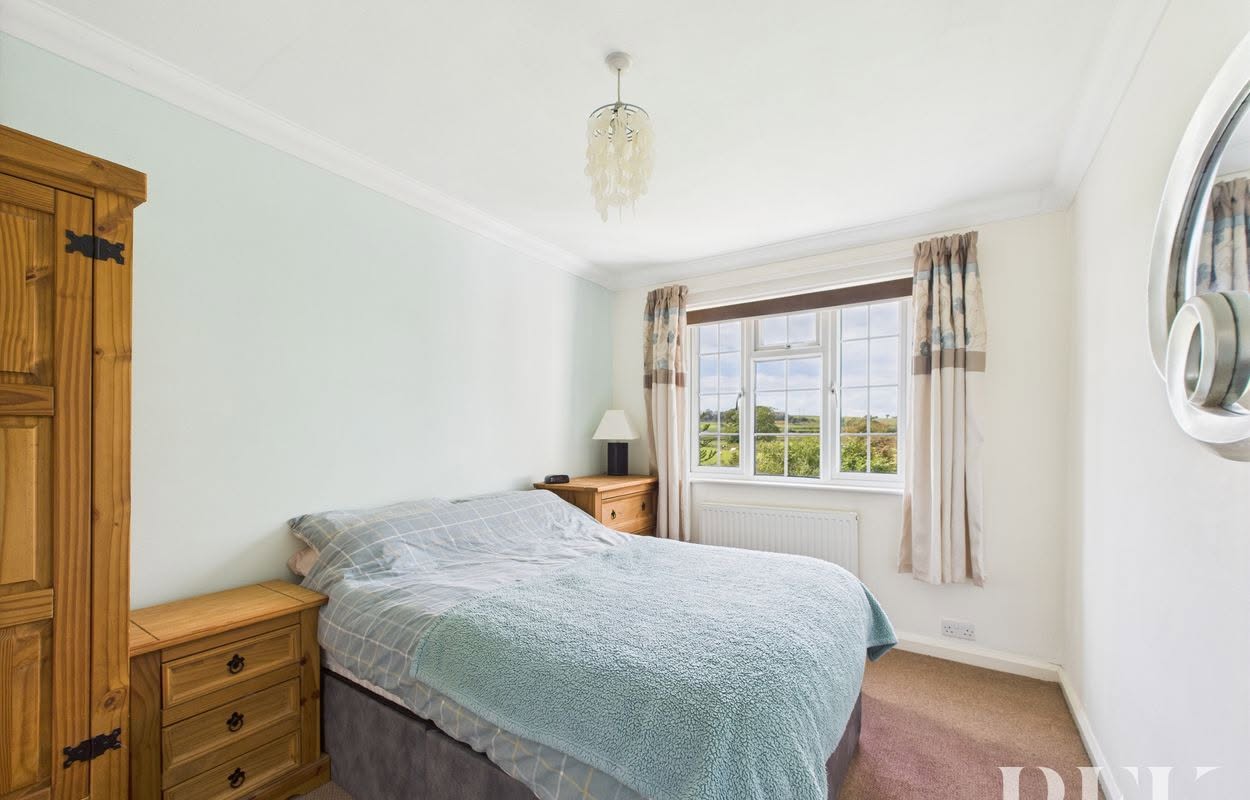 A calm and light-filled bedroom at Heather Lea