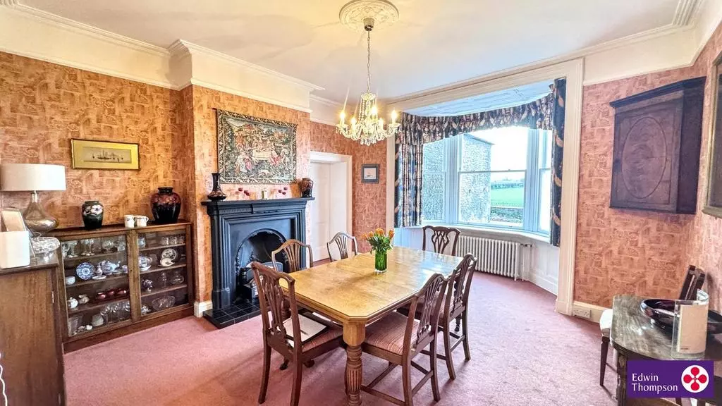 Kirkland House's traditional dining room with fireplace