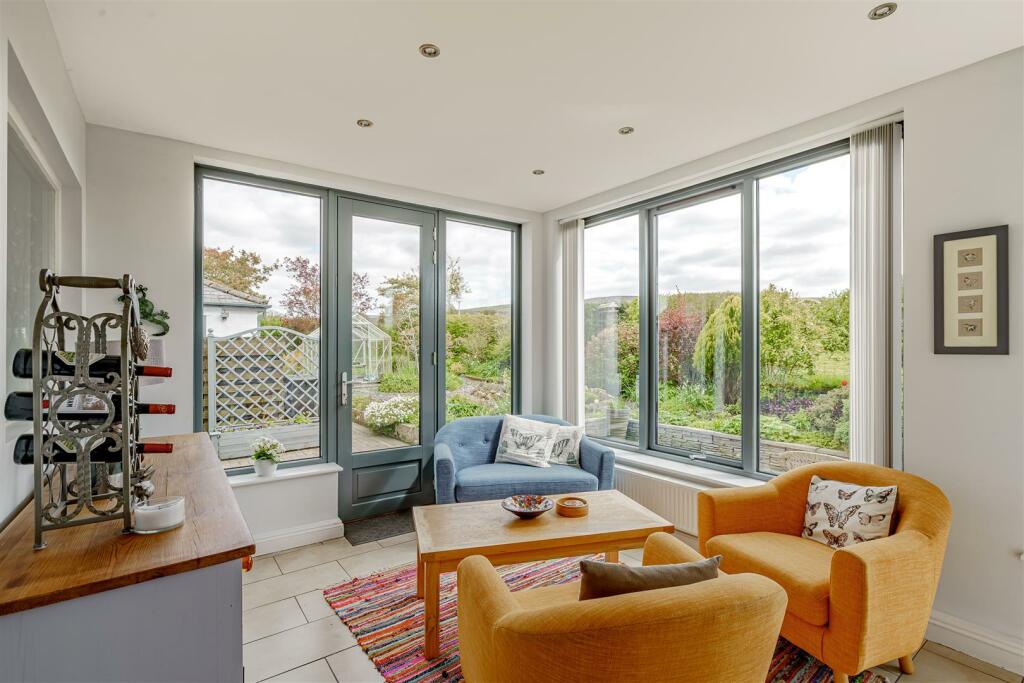 Roxboro's light-filled garden room with colourful seating