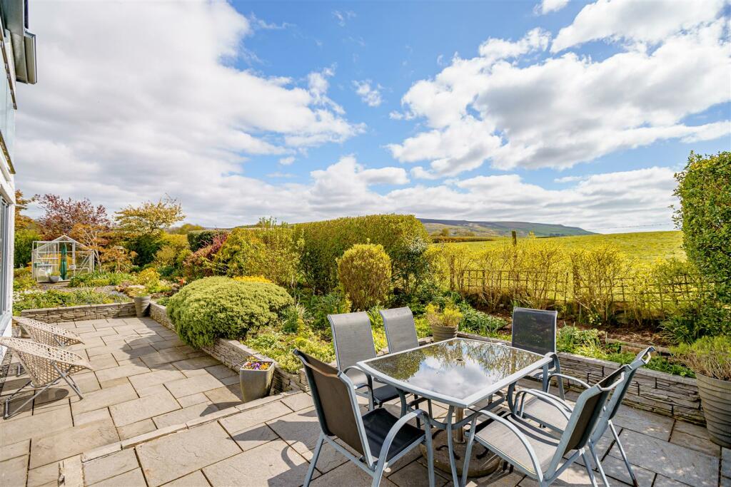 Roxboro's patio and garden looking towards the surrounding countryside
