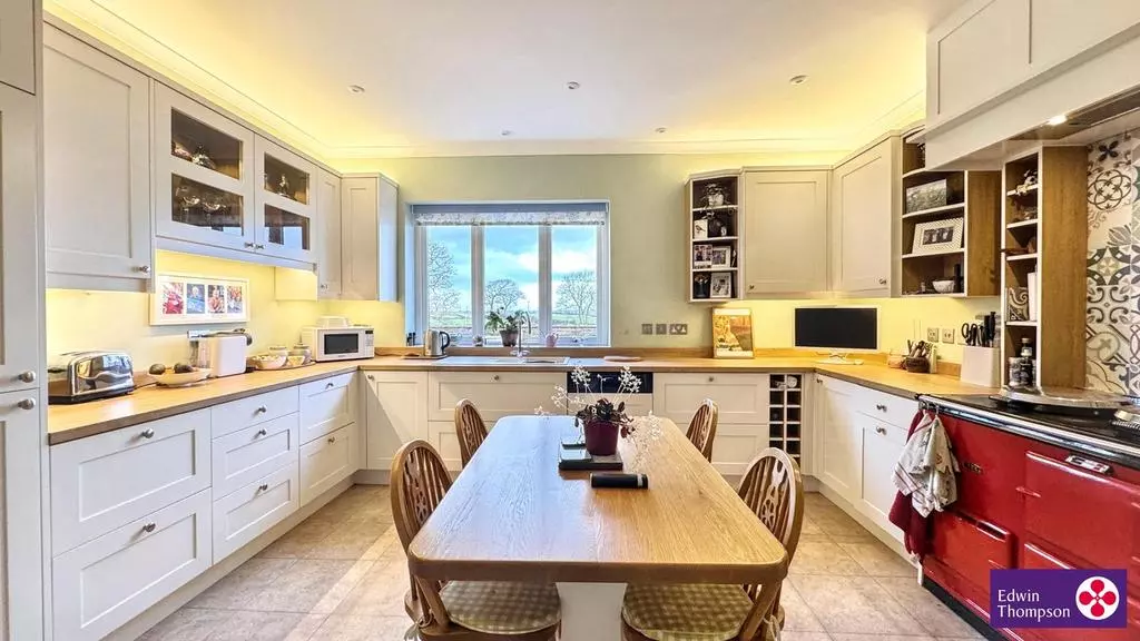 Kirkland House's spacious family kitchen with central dining table